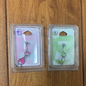New in Package! Set of 2 cute belly rings. Pink is My Melody & Green is Keroppi